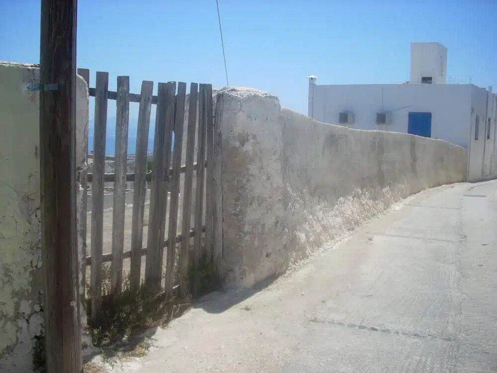 Land For Sale Santorini with one house and 3 caves ideal to redevelop