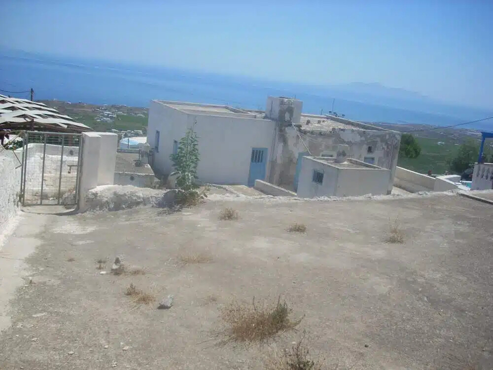 Land For Sale Santorini with one house and 3 caves ideal to redevelop