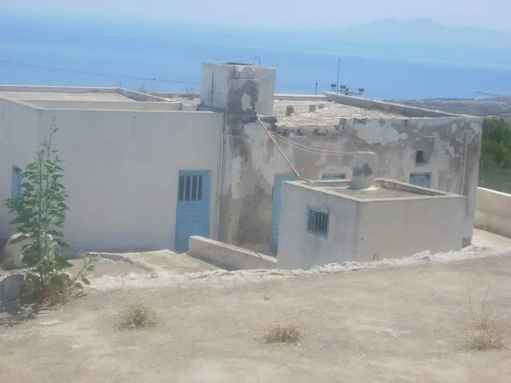 Land For Sale Santorini with one house and 3 caves ideal to redevelop