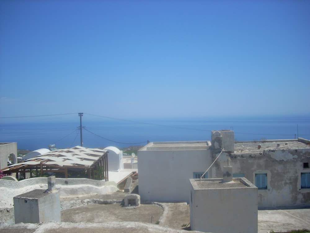 Land For Sale Santorini  with one house and 3 caves ideal to re-develop