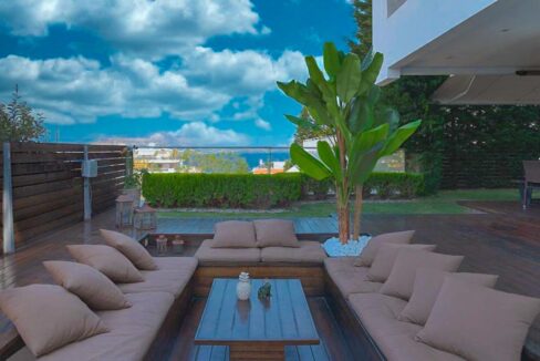 Apartment with a garden and a swimming pool, Varkiza Athens for sale. Luxury Property for sale near Vouliagmeni